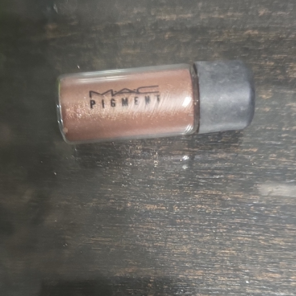Tan MAC Cosmetics Pigment. Color is Tan